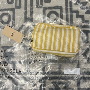 The belt bag in honey stripe yellow